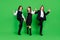 Full size photo of funny little girl boys hold hands go wave wear school uniform isolated on green background