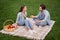 Full size photo of good mood couple boyfriend and girlfriend talk have conversation laughing have picnic outdoors