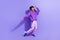Full size photo of good mood person wear violet hoodie sport pants shout celebrate winning lottery isolated on purple