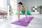 Full size photo of gorgeous positive slender girl plank stand fitness carpet push ups challenge spacious flat indoors