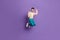 Full size photo of happy cheerful gentleman raise fists win jump air isolated on violet color background