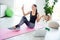 Full size photo of happy cheerful smiling beautiful sportive athlete girl sit fit mat making sport vlog at home house