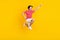 Full size photo of happy joyful young raise hand super hero jump up empty space good mood isolated on yellow color