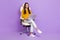 Full size photo of lady sit type laptop wear blouse trousers boots  on purple color background