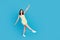 Full size photo of lovely cheerful girl point fingers dancing clubbing isolated on blue color background