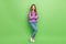 Full size photo of lovely funny girl with long hairstyle dressed jeans purple pullover arms crossed isolated on green