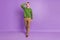 Full size photo of millennial boss brunet guy stand look wear sweater trousers sneakers isolated on purple background