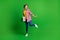 Full size photo of nice funky lady dancing hold boombox wear jeans shirt sneakers isolated on green background