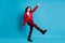Full size photo of optimistic girl sing dance wear red jacket trousers shoes isolated on blue color background