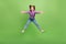 Full size photo of optimistic good mood girl dressed jeans purple pullover jumping cuddling you isolated on green color