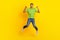 Full size photo of overjoyed excited man jumping point fingers self himself isolated on yellow color background
