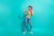Full size photo of overjoyed nice girl touch headphones listen new single isolated on teal color background