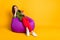 Full size photo of sad bored lady sit bean bag hold telephone wear sweater pants shoes isolated yellow color background