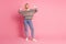 Full size photo of self confident lovely woman wear ornament pullover denim pants directing at herself isolated on pink