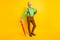 Full size photo of senior man happy positive smile hand touch suspenders parasol forecast isolated over yellow color