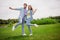 Full size photo of smiling good mood dancing couple enjoying free time active energetic weekend spend free time