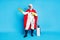 Full size photo of strong power medical worker man hold golden crown use disinfection equipment spray wear red mantle