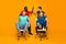 Full size photo two men afro american meeting hold hands high five gesture persuade blonde hair pals office chair ride