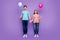 Full size photo of two people cute guy lady couple hold hands colorful air balloons came students party youth wear