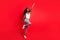 Full size photo of young attractive black girl happy positive smile look empty spae superhero isolated over red color