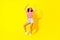 Full size photo of young attractive sporty lady celebrating dancing cool weekend chill isolated on brighth yellow color