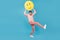 Full size photo of young excited guy happy positive hold big yellow smile emoji isolated over blue color background