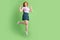 Full size photo of young lady have fun show peace cool v-sign trip dreamy isolated over green color background