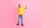 Full size photo of young small boy happy positive smile show fingers cool peace v-sign isolated over pink color