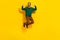 Full size portrait of carefree cheerful guy jumping point fingers self himself isolated on yellow color background