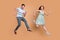 Full size profile photo of attractive lady handsome guy excited married couple jump high running shopping center sale