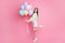 Full size profile photo of charming lady birthday party best friend guest hold air balloons congrats wear casual green