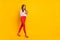 Full size profile photo of walking lady write blog post wear positive comment isolated on yellow color background