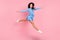 Full size profile side photo of young asian girl happy positive smile split jump active isolated over pink color