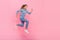 Full size profile side photo of young excited girl run energetic look empty space hurry isolated over pink color