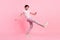 Full size profile side photo of young man happy positive smile enjoy music dancer club isolated over pink color