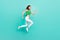 Full size profile side photo of youth lady jump runner hurry movement isolated over turquoise color background