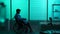 Full-sized silhouette video of a disabled man, patient with mobility impairment entering the frame on a wheelchair