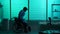 Full-sized silhouette video of a disabled man, patient with mobility impairment trying to get up from a wheelchair