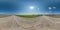 Full spherical seamless hdri panorama 360 degrees angle view on no traffic white sand gravel road  with sun on clear blue sky in