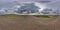 Full spherical seamless panorama 360 degree angle view on no traffic old asphalt road among fields with dark overcast sky before