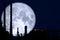 Full Strawberry Moon back on silhouette refinery on night sky