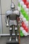 Full suit of knight armour and weapon on the street on balloon background.