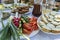 Full table of ukrainian meals on the table for eat. Table with many ready meals and food in the summer garden, outdoors, closeup