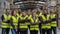 Full team of warehouse employees standing in warehouse. Team of workers, managers, female director in modern industrial