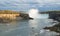 Full view of Niagara Falls, the escarpment and a tour boat from Canadian side.