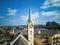 Full view and partial close-up of European-style steeple church, Gothic architecture