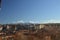 Full views of the city of Segovia with mountains with snow in the background