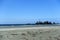 A full wide view of the beautiful Chesterman Beach at low tide outside Tofino, British Columbia, Canada.