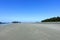 A full wide view of the beautiful Chesterman Beach at low tide outside Tofino, British Columbia, Canada.