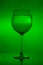 Full wine glass on green background, full wineglass